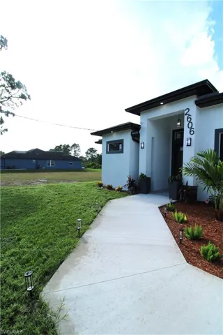 View of front of property with a front lawn
