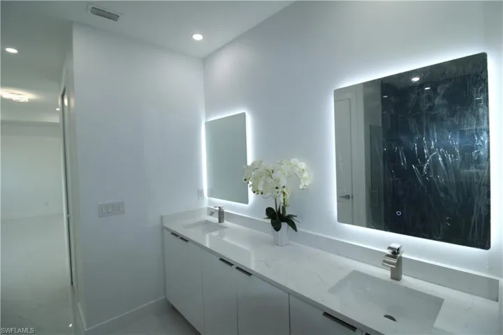 Bathroom featuring dual vanity and tile flooring