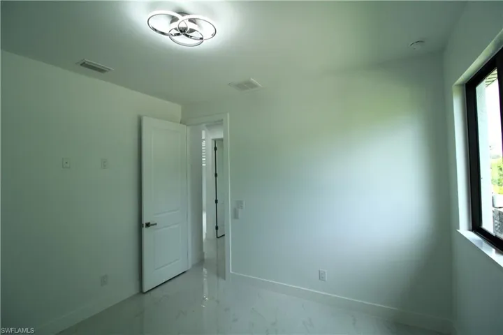 Empty room featuring tile flooring