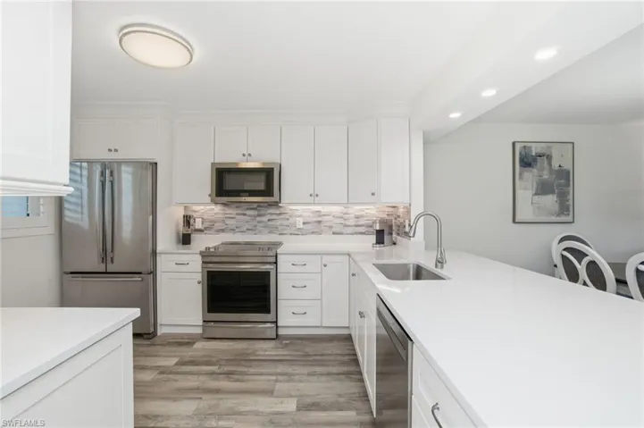 Fresh and clean new kitchen with plenty of storage and prep space