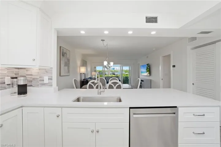 Kitchen flows into the open concept dining and living area