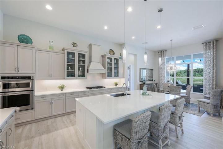Dine at the kitchen island or at the dining table overlooking the spectacular pool.