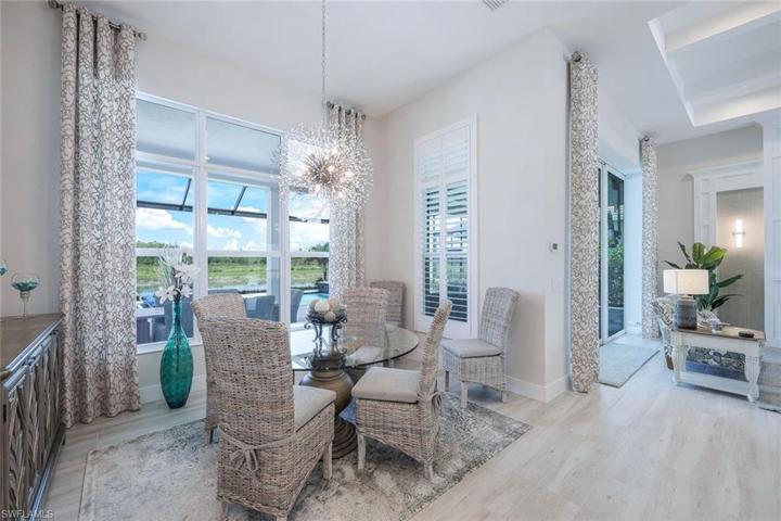 Dining area with custom light fixture.