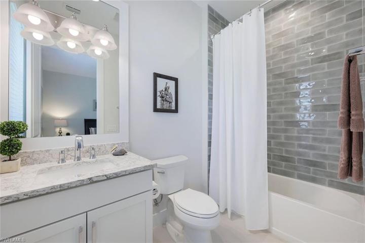 Guest bathroom with custom tile to ceiling.