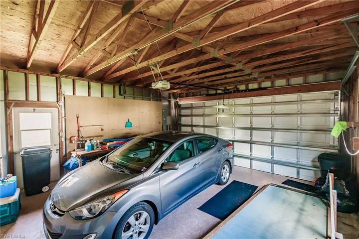 Garage featuring a garage door opener