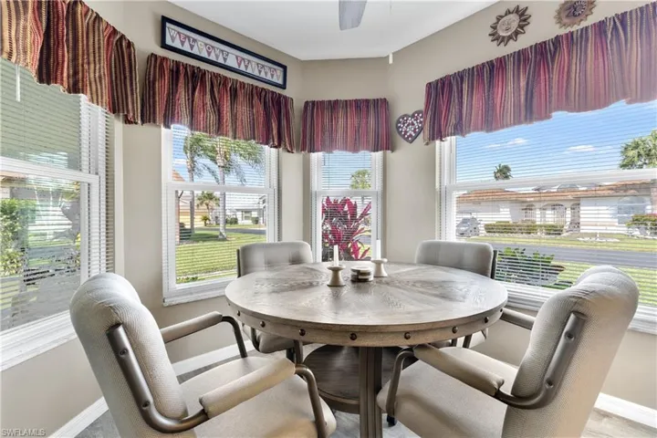 Dining space featuring baseboards and ceiling fan