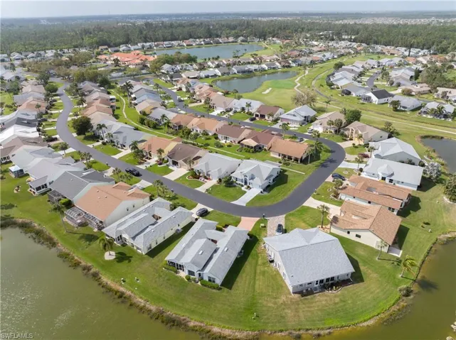 View of property location featuring a nearby body of water and nearby suburban area