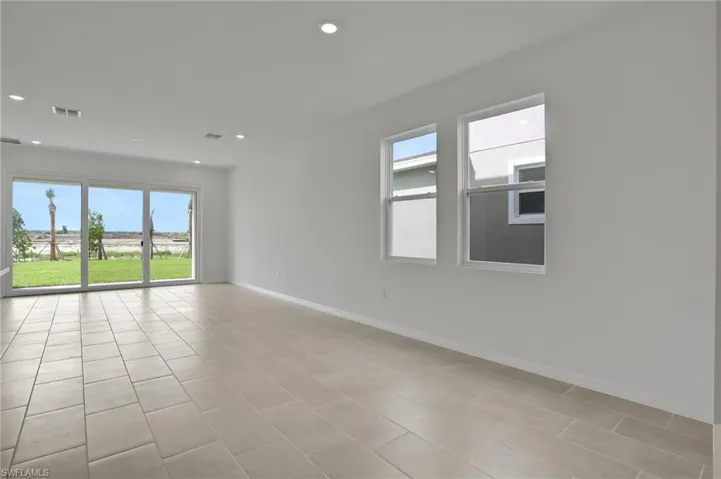 Spare room featuring recessed lighting and light tile patterned floors