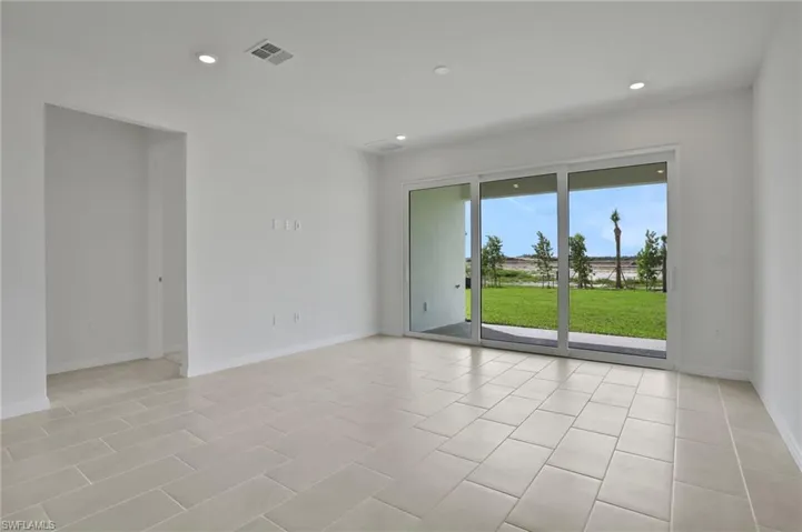 Empty room featuring recessed lighting