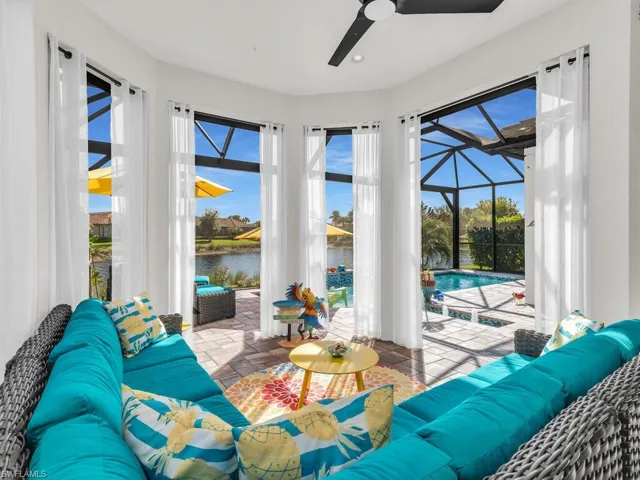Gorgeous Carribean style Lanai overlooking pool & lake w/ electric storm shades