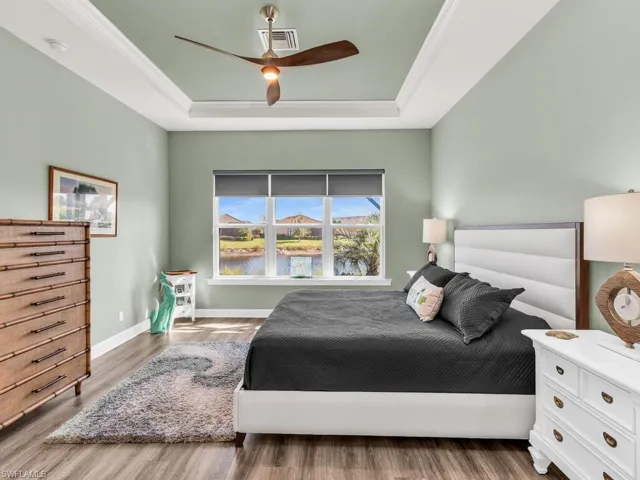 oversized BR with tray ceiling, pool and lake views