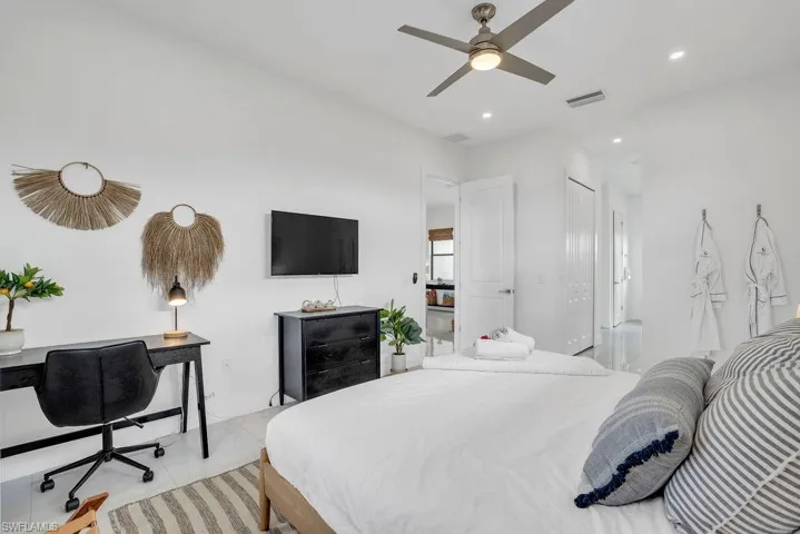 Bedroom featuring a desk, ceiling fan, recessed lighting, and a closet