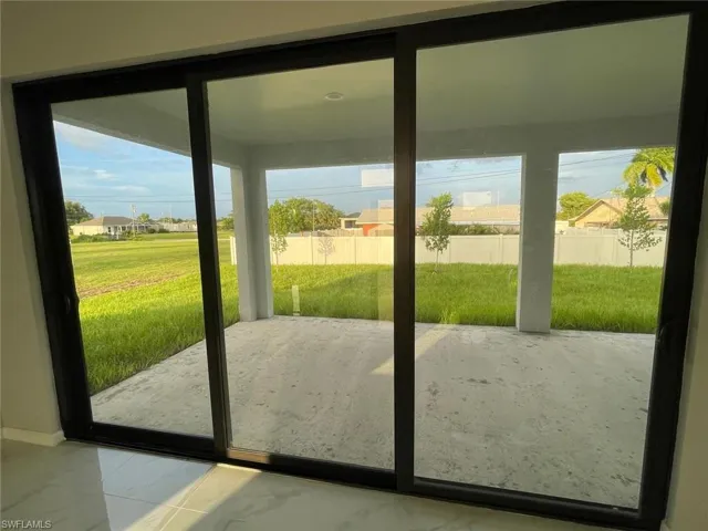 Doorway to outside with tile patterned flooring