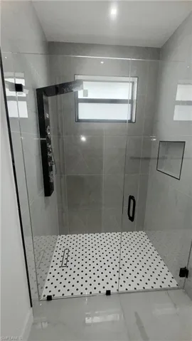 Bathroom featuring a shower stall