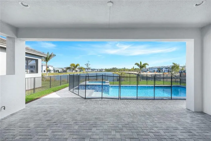 View of pool featuring an in ground hot tub and a patio