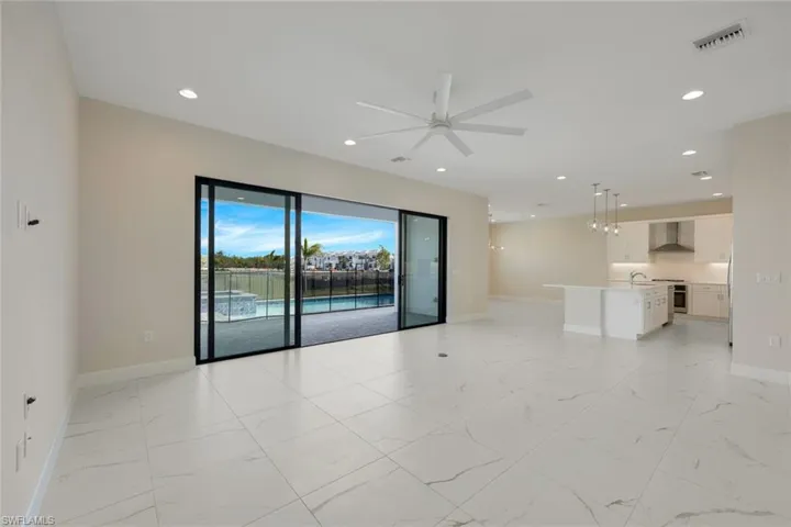 Empty room featuring ceiling fan