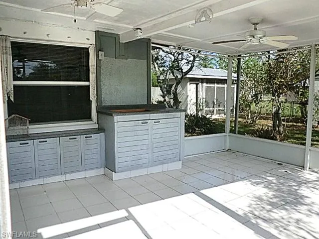 Matching remote fans in screen porch with cabinets