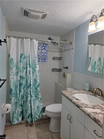 Full bath with vanity, a stall shower