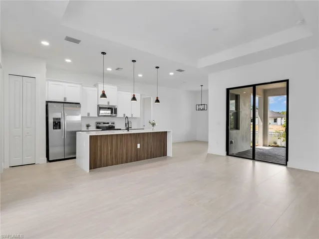 Open concept living space and kitchen with large island