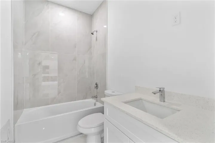Full bathroom with vanity and shower / bathtub combination