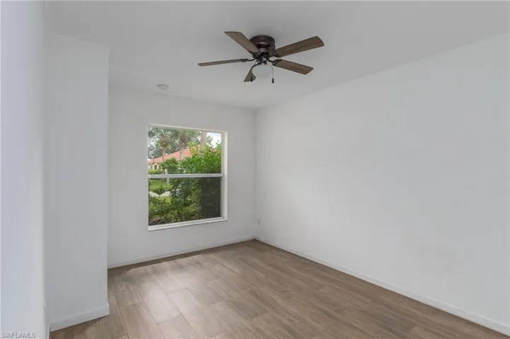 Spare room with light wood-style floors and ceiling fan