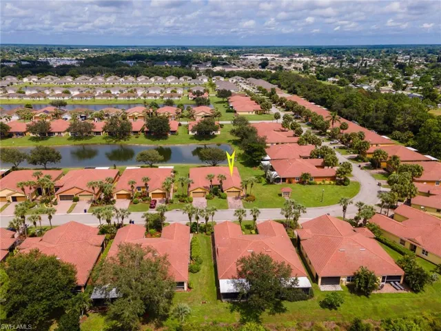 Aerial perspective of suburban area with a large body of water