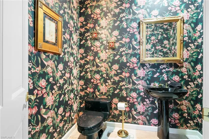 1/2 Bath featuring tile patterned flooring and toilet