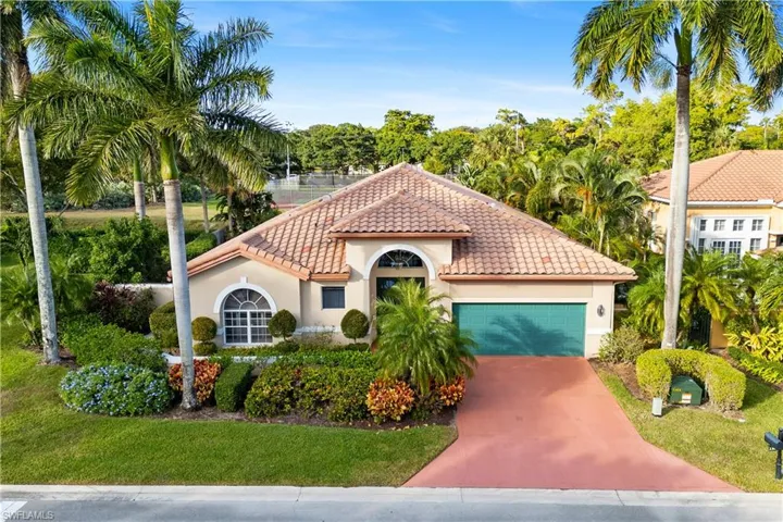 Mediterranean / spanish-style house with a garage