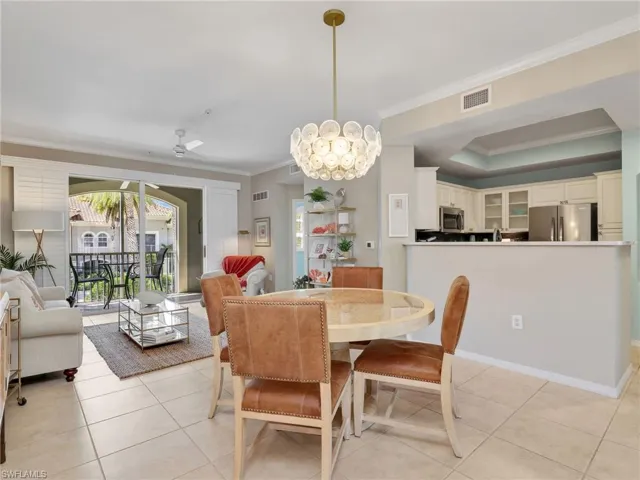 Dining Area & Living Room with Crown Molding & Ceiling Fan & Sliders With Plantation Shutters