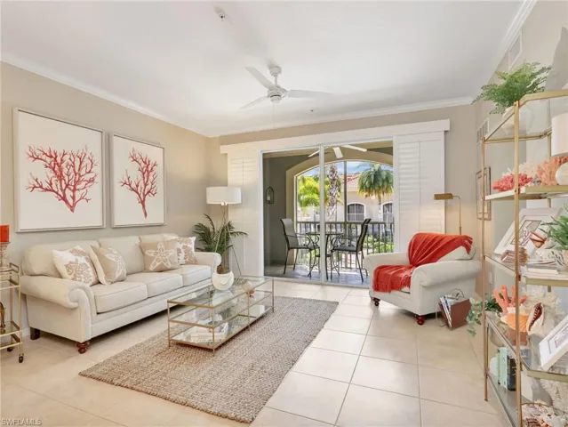 Living Room with Crown Molding and Ceiling Fan & Sliders with Plantation Shutters