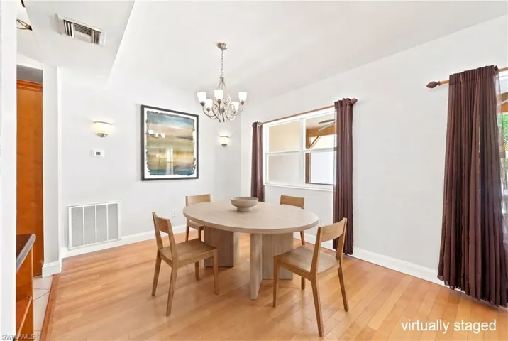 dining room off kitchen with staged table