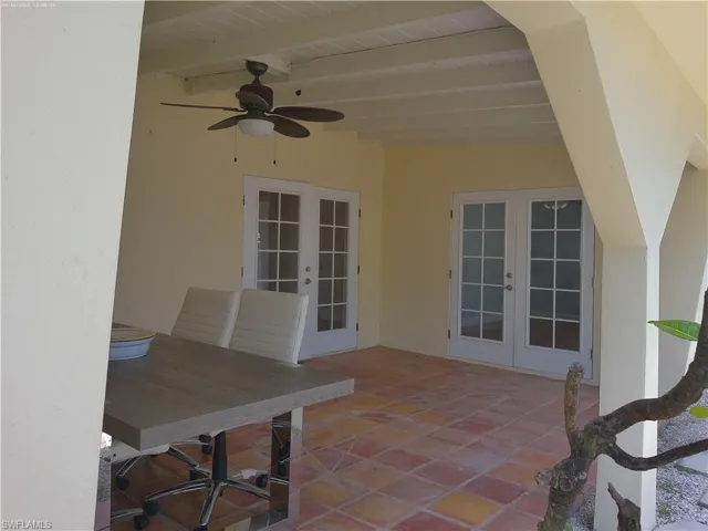 large outdoor Patio with a large pass through window from the kitchen to patio