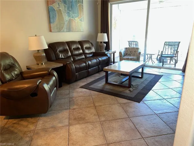 Living room with light tile patterned floors