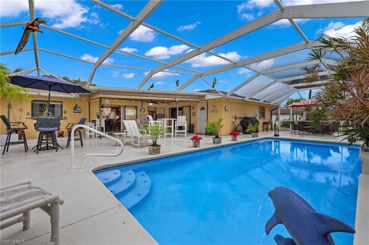 Huge screened in pool area with several different sitting areas