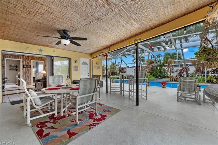 Large undercover portion of Lanai has two pocketing sliders to the interior as well a door accessing the pool bath