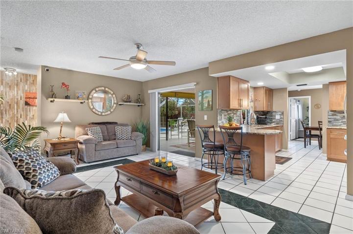 Bonus secondary living room off of the kitchen walks out to the lanai