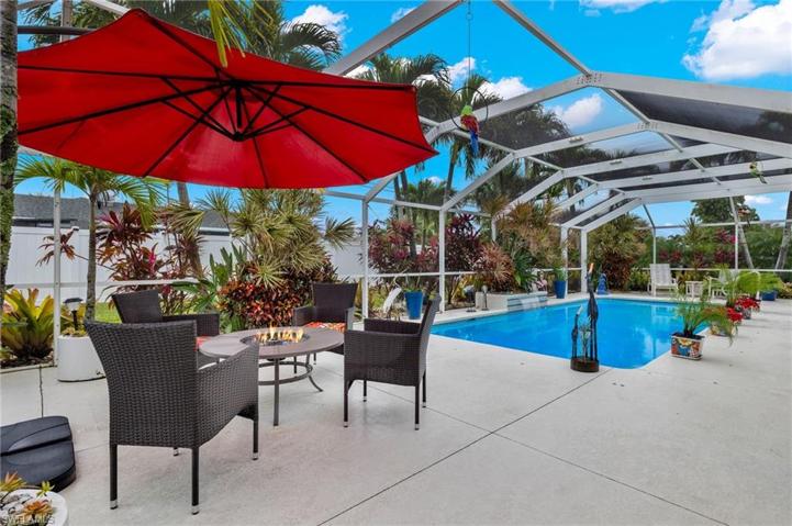 Lanai is surrounded by topical landscaping that also provides privacy.  New vinyl fence for privacy from neighbors behind