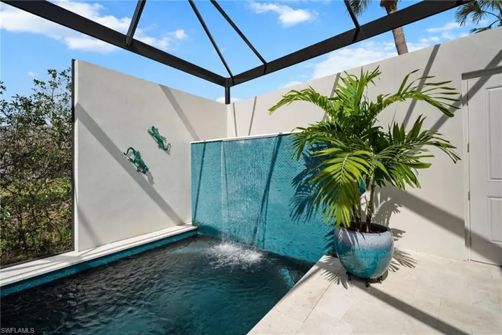 View of swimming pool with pool water feature