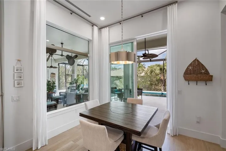 Dining area with light hardwood / wood-style floors