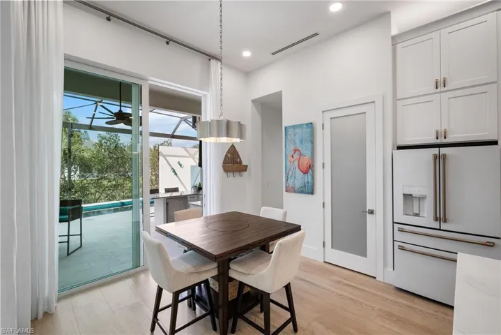Dining space featuring ceiling fan and light wood-type flooring
