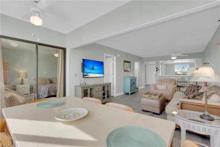 Dining room featuring a ceiling fan and wood finished floors