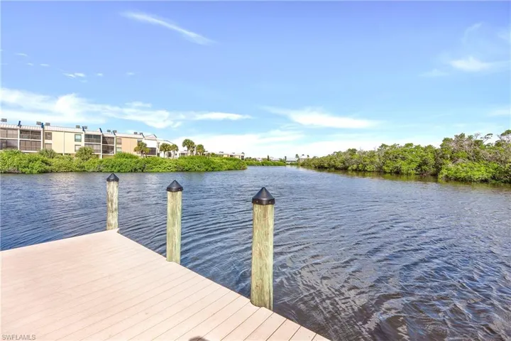 Dock area featuring a water view