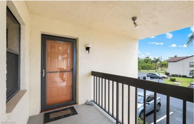 Entrance to property featuring stucco siding