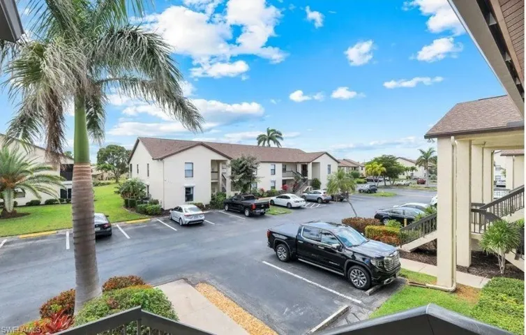 Uncovered parking lot with a residential view