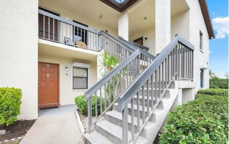 View of exterior entry with stucco siding