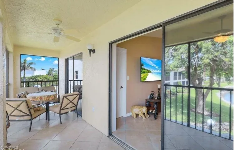Sunroom / solarium featuring ceiling fan and a balcony