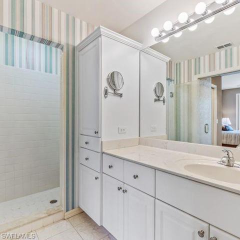 private bath one sink but addl cabinets for linens towels