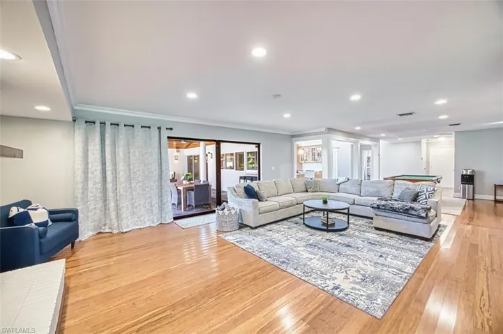 Family room with light wood finished floors, recessed lighting, crown molding, and pool table
