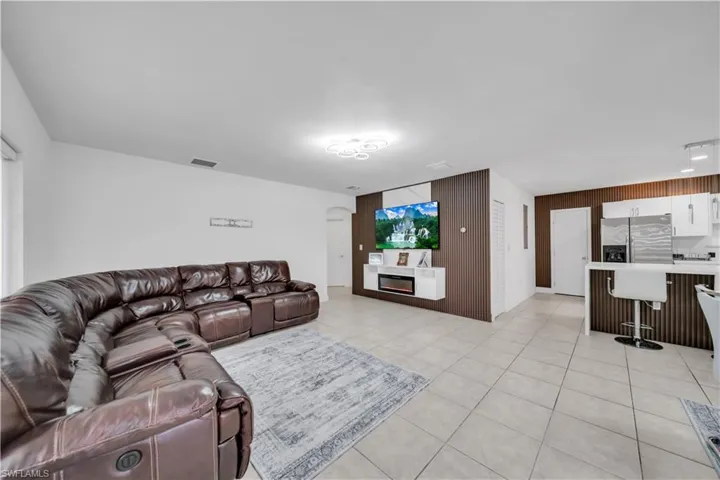 Open concept living space featuring tile flooring throughout