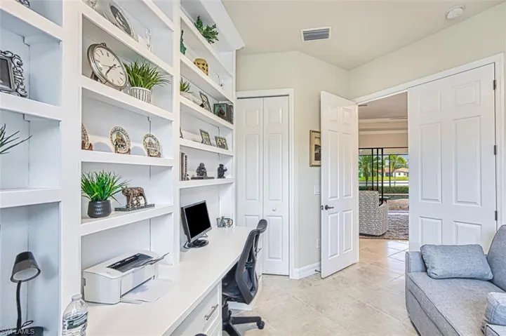 Office area with light tile patterned floors